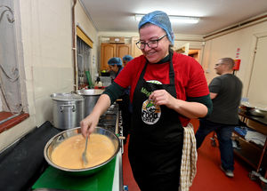Magdalena Kot at work in the kitchen preparing the potato and leek soup