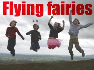 Supporting image for story: Youngsters climb hill in twins' memory