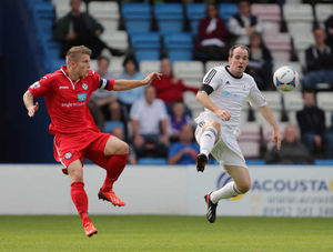 Darren Campion of Hednesford Town and Robbie Booth of AFC Telford United