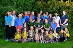 Sue Blake, Lesley Dyer and Sandra Pugh with their roses, and Charotte Lilly and members of 1st Admaston Guides