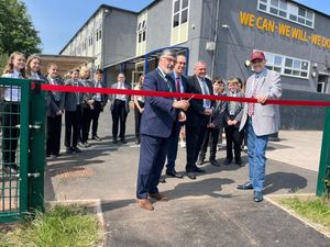 Marc Jordan, outgoing CEO of Creative Education Trust, is pictured cutting the ribbon at the unveiling of the new improvements, which include a reading nook, at The Hart School.