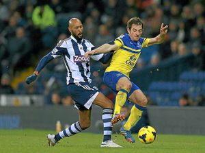 Nicolas Anelka challenges Leighton Baines