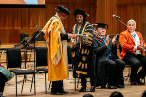 Anita Bhalla OBE, Chair of the Board of Governors for BCU presenting the honorary doctorate.