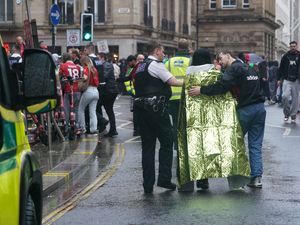 Emergency workers helping an injured person
