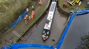 Waterways engineers working alongside the Canal and River Trust refill an area of canal containing the Pacemaker boat, as they begin repairs to a large "sinkhole" which breached a canal in the Chemistry area of Whitchurch. Photo: Jacob King/PA Wire 