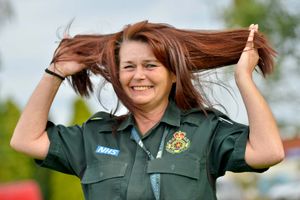 Donna Davenport prepares to have her long locks shaved off for charity