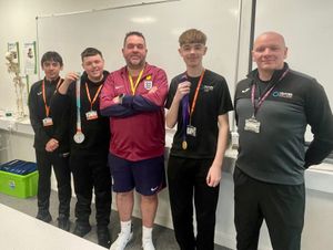 Kevin Fenner with sports students Ryan Povey, Liam Downing, Ethan Wynn and lecturer Jason Jones, who got to see and hold his gold and silver medals from the Euros and World Cup.