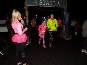 Runners starting off at the glow run