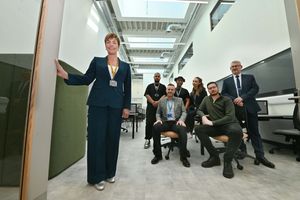 Louise Fall shows off some of the corridors and main areas to visiting students and dignitaries