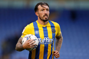 Ryan Bowman of Shrewsbury Town celebrates winning the game and scoring a hat trick with the match ball at the end of the game (AMA)