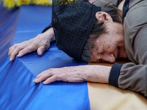 Supporting image for story: Ukraine mourns dead from major Russian strike