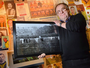 John 'Foz' Hendley pictured last year with an old photo of Molineux
