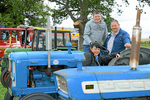 Dave, Michael and Louise Steele on their 1964 Fordson Super Major at the Weston-under-Redcastle Village Show