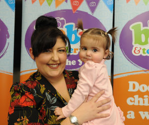 Winner of the 10 to 18 months category Esme-Rose Marsh, with mother Letitia Lock