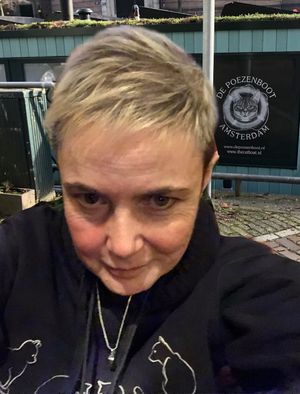 Lisa Murray-Lang with Spud in a vial around her neck in Amsterdam. Photo: Lisa Murray-Lang/SWNS