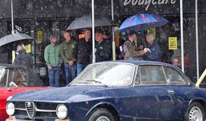 Visitors to the Bridgnorth Italian Moto Fest brave the horrendous downpours to view the cars on show