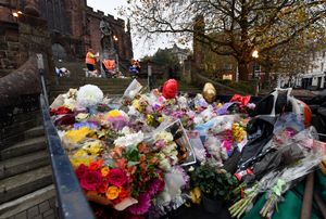 Dozens of bouquets of flowers and other tributes were moved from outside St Peter's Collegiate Church 