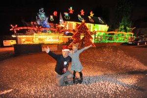 Poppy Nicholls, aged eight, turning on the 2013 Christmas lights with then landlord John Coombes 