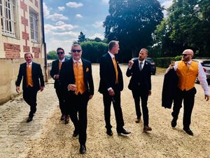 The couple's Wolves-themed wedding saw the best man and ushers in old gold waistcoats