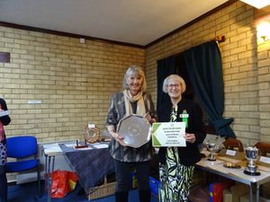Julie Hughes, Aston-by-Stone WI receiving the Garden Festival Trophy for a hedgehog crafted from recycled materials