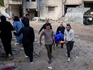 The body of a Palestinian killed in an Israeli army airstrikes is brought to Shifa Hospital in Gaza City