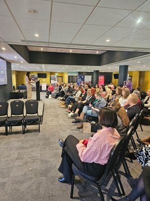 Kiranjit Janagal speaks to attendees about their well-being and staying well