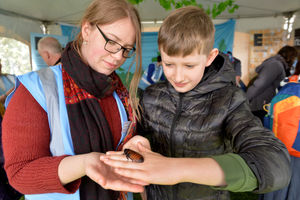 Abi Enston shows Fred Davis from Stourbridge a hissing cockroach