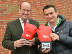 Supporting image for story: Boxing champ's glove raises £200 for cancer fight