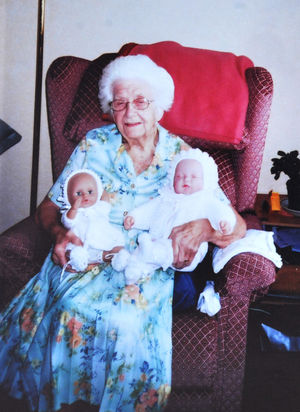 Marjorie Wainwright, with dolls she made clothes for.