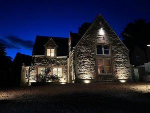 The house lit up at night. Picture: Rightmove and Peter James Property Ltd.