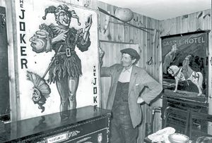 Stafford antique dealer Thomas Timmins had tapped into a thriving market selling pub signs to Australia from his antique shop in Eccleshall in 1977. Pictured with some of the signs was Bill Lindop, aged 65,  who had been helping out in the shop since he retired.