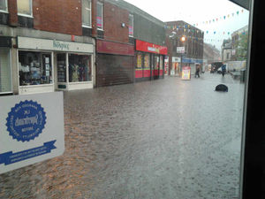 This picture was taken by Specsavers staff during flooding four years ago