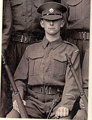 Roger holding a rifle