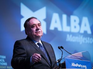 Supporting image for story: Salmond’s coffin draped in Saltire as plane to return him to Scotland takes off