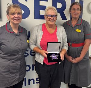 Jan Meredith (centre) was presented with her Cavell Star award by Rachel Armstrong (left) and Donna Clark
