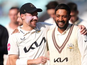 Surrey captain Rory Burns (left) and Ryan Patel celebrate