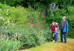 Laura McGee with son Camden, aged three, and his grandad John Moores, from Wombourne at Wightwick Manor in Wolverhampton