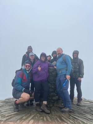 Prashant and Lauren were joined by 25 friends and family (some pictured at the top of Snowdon)