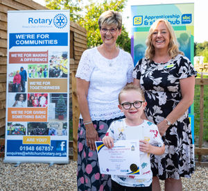 Diane Nelson, of the Grocott Family Charitable Trust, and Amanda Carpenter, of SBC Training, with Elliott Beddows