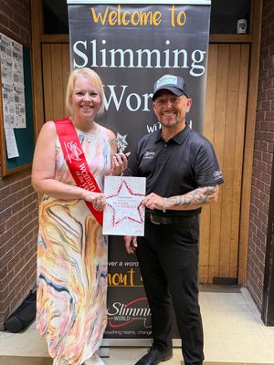 Becks receiving her Woman of the Year Award from her Consultant Lord Paul Green