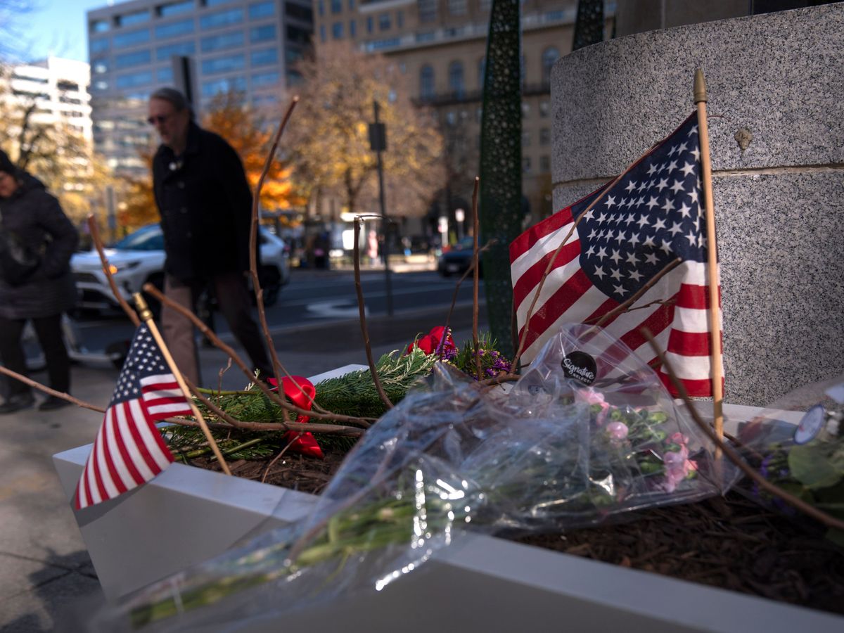 US halts asylum rulings as National Guard shooting suspect faces murder charge