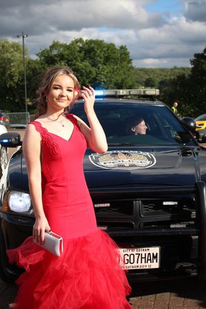 Lexi Corbett arriving in a Gotham City Police Car