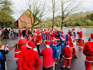 Supporting image for story: Scores of Santas running around Llandrindod Wells lake - when to see the sensational spectacle