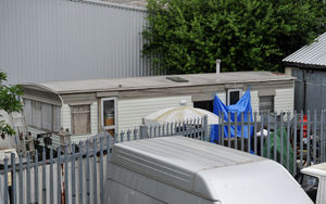 A blue tarpaulin has been put up on a caravan at the Doulton Trading Centre