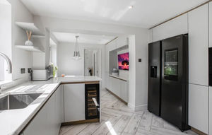 The modern kitchen is fully equipped for any cooking needs