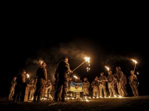 Servicemen attend a dedication ceremony for soldiers near the frontline in the Donetsk region, Ukraine