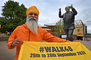 Manny Singh Kang is preparing to walk around Molineux Stadium for 48 hours