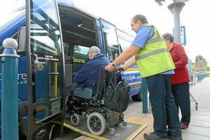 Bruce is helped onto the Shropshire Link bus