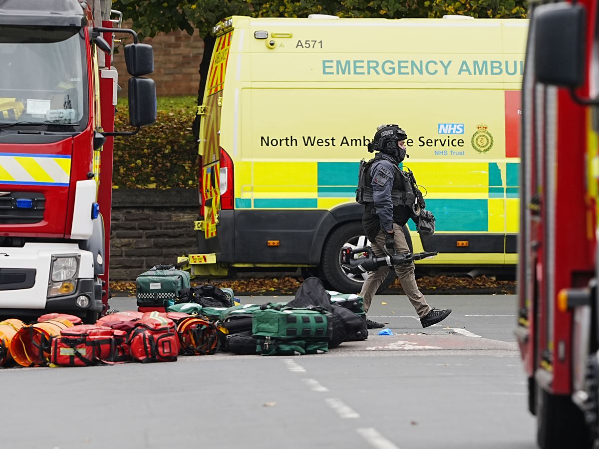 Two dead and suspect shot after suspected terror attack at synagogue