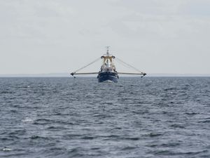 A scallop dredger working at sea